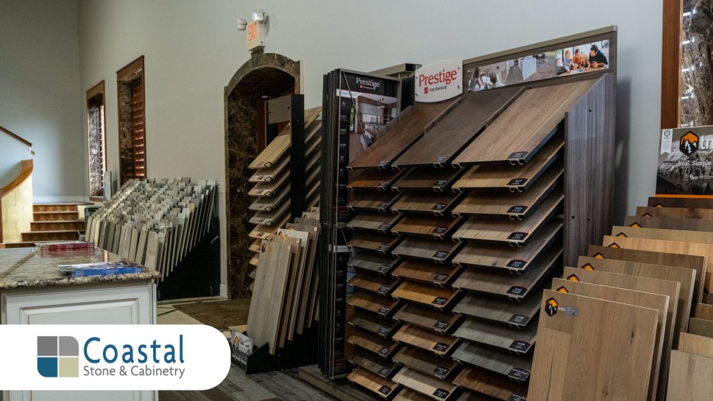 Flooring showroom displays of engineered hardwood and luxury vinyl plank at Coastal Stone & Cabinetry